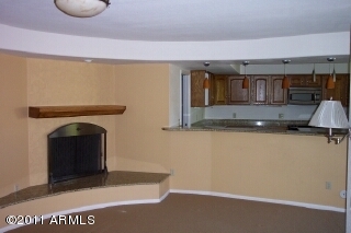 2130 East Lawrence Road Phoenix, AZ 85016 - Photo 4 of 7 Family room and fireplace