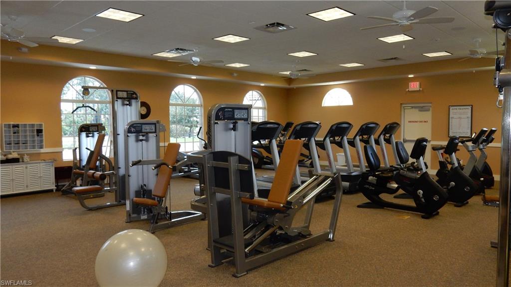 6740 Dennis Circle, Unit B103 Naples, FL 34104 - Photo 11 of 16 a view of a room with gym equipment