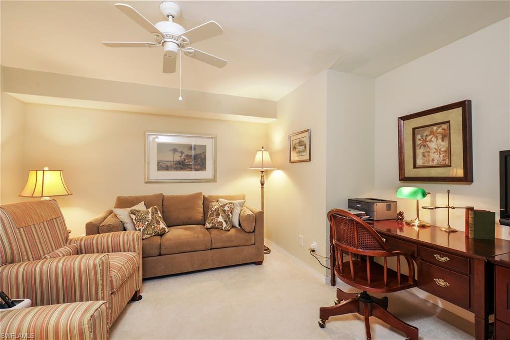 6740 Dennis Circle, Unit B103 Naples, FL 34104 - Photo 5 of 16 a living room with furniture and a window