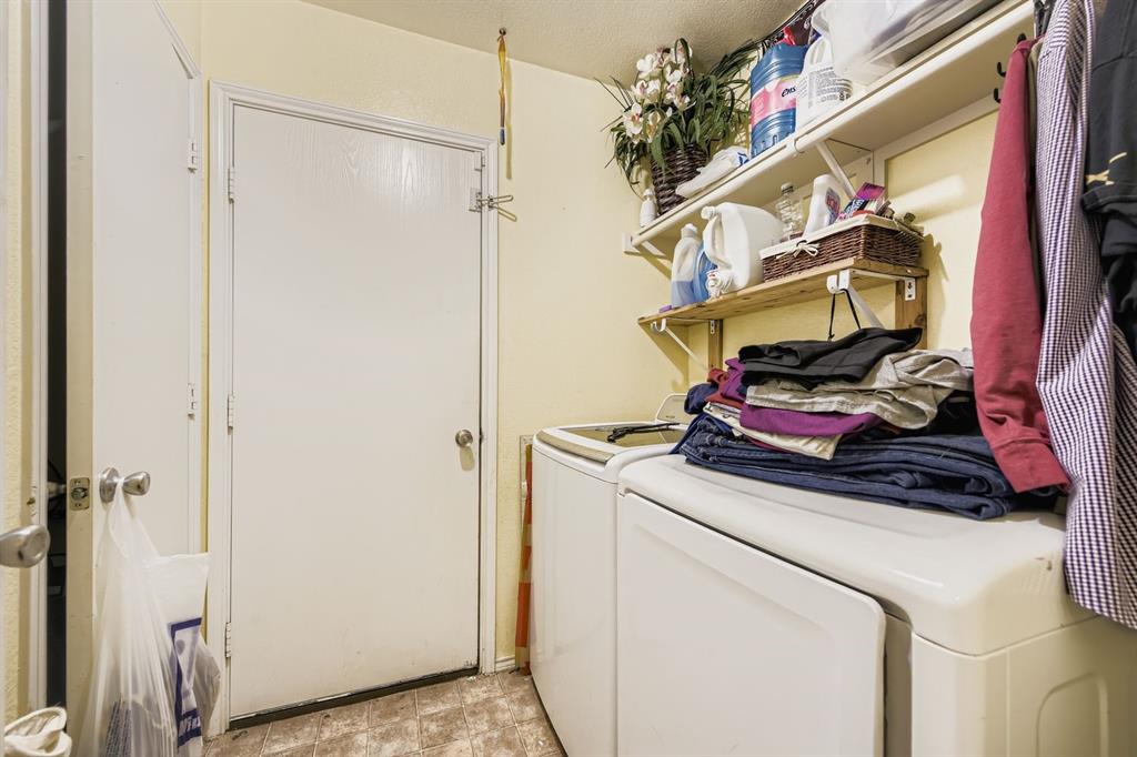 2228 Sims Drive Fort Worth, TX 76119 - Photo 15 of 15 a utility room with dryer and washer