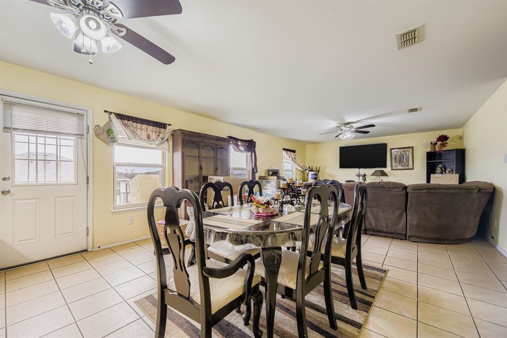 2228 Sims Drive Fort Worth, TX 76119 - Photo 5 of 15 a view of a dining room with furniture and a chandelier