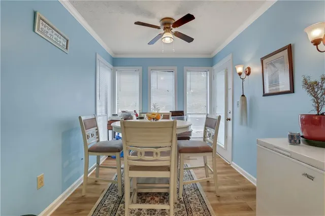 a dining room with furniture and window
