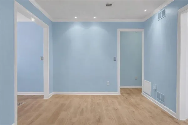 a bedroom with furniture and wooden floor