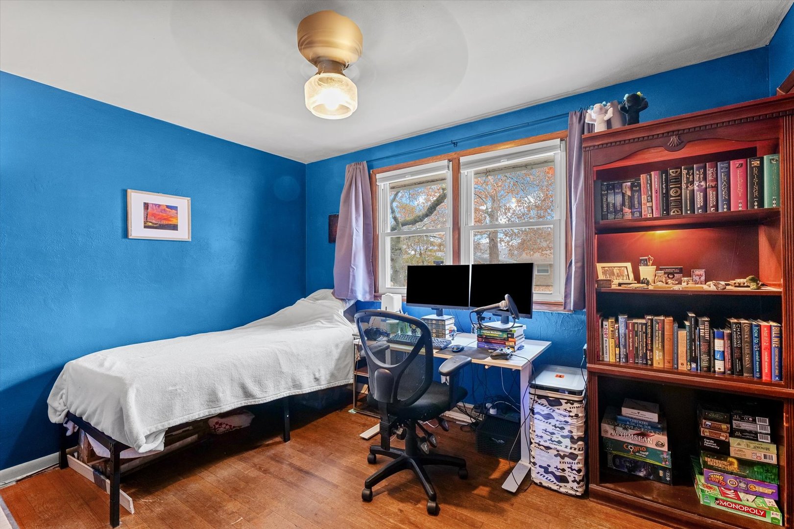 2213 Roland Drive Champaign, IL 61821 - Photo 12 of 21 a bedroom with a workspace and a book shelf