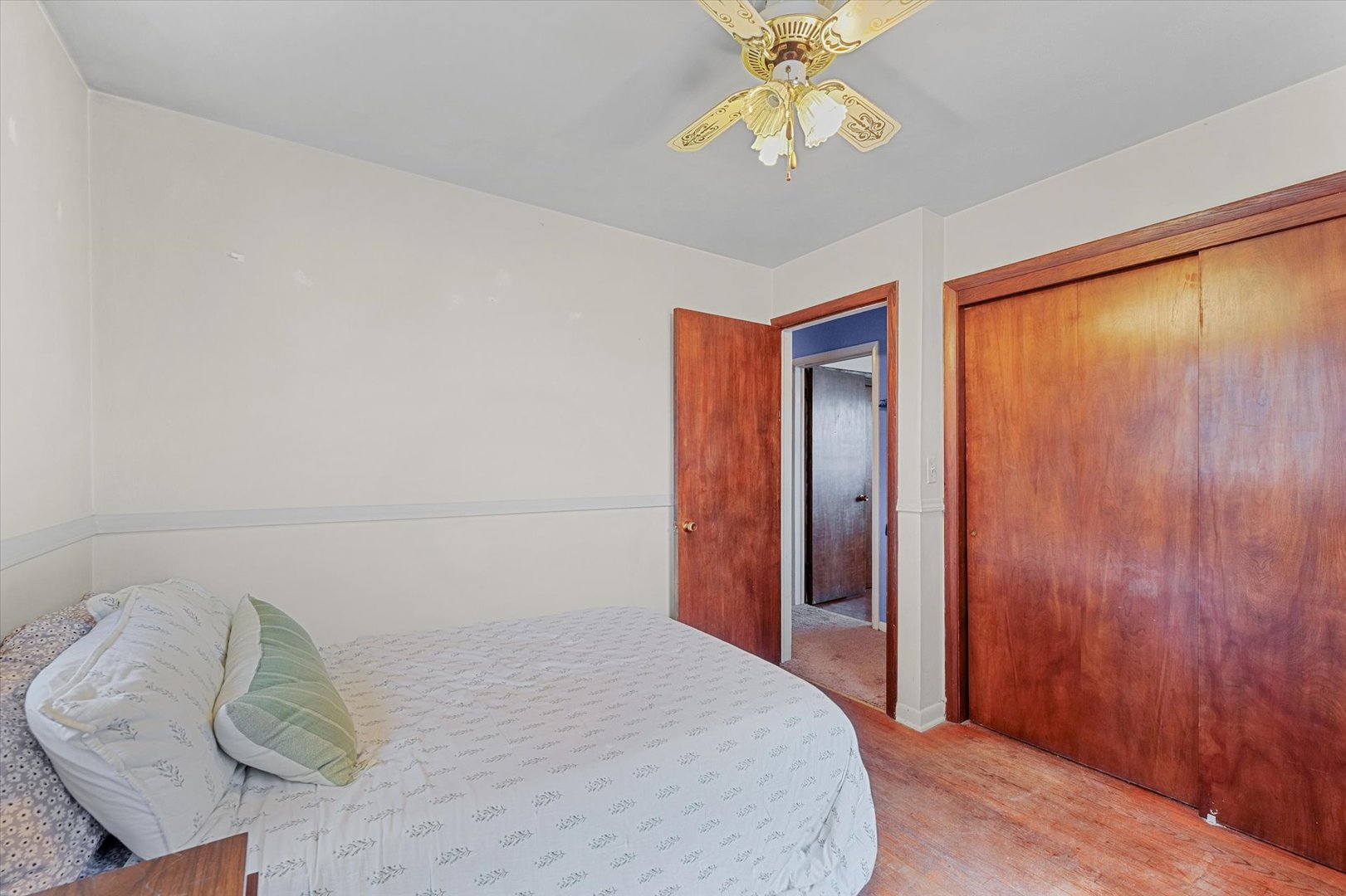 2213 Roland Drive Champaign, IL 61821 - Photo 15 of 21 a bedroom with a bed and a chandelier