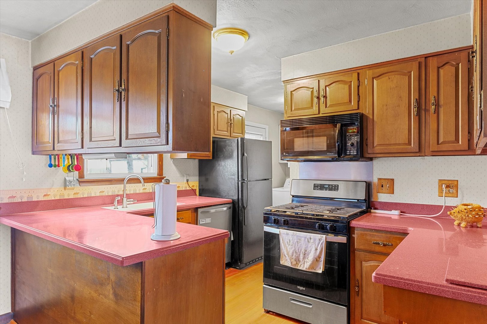 2213 Roland Drive Champaign, IL 61821 - Photo 6 of 21 a kitchen with stainless steel appliances granite countertop a stove refrigerator and cabinets