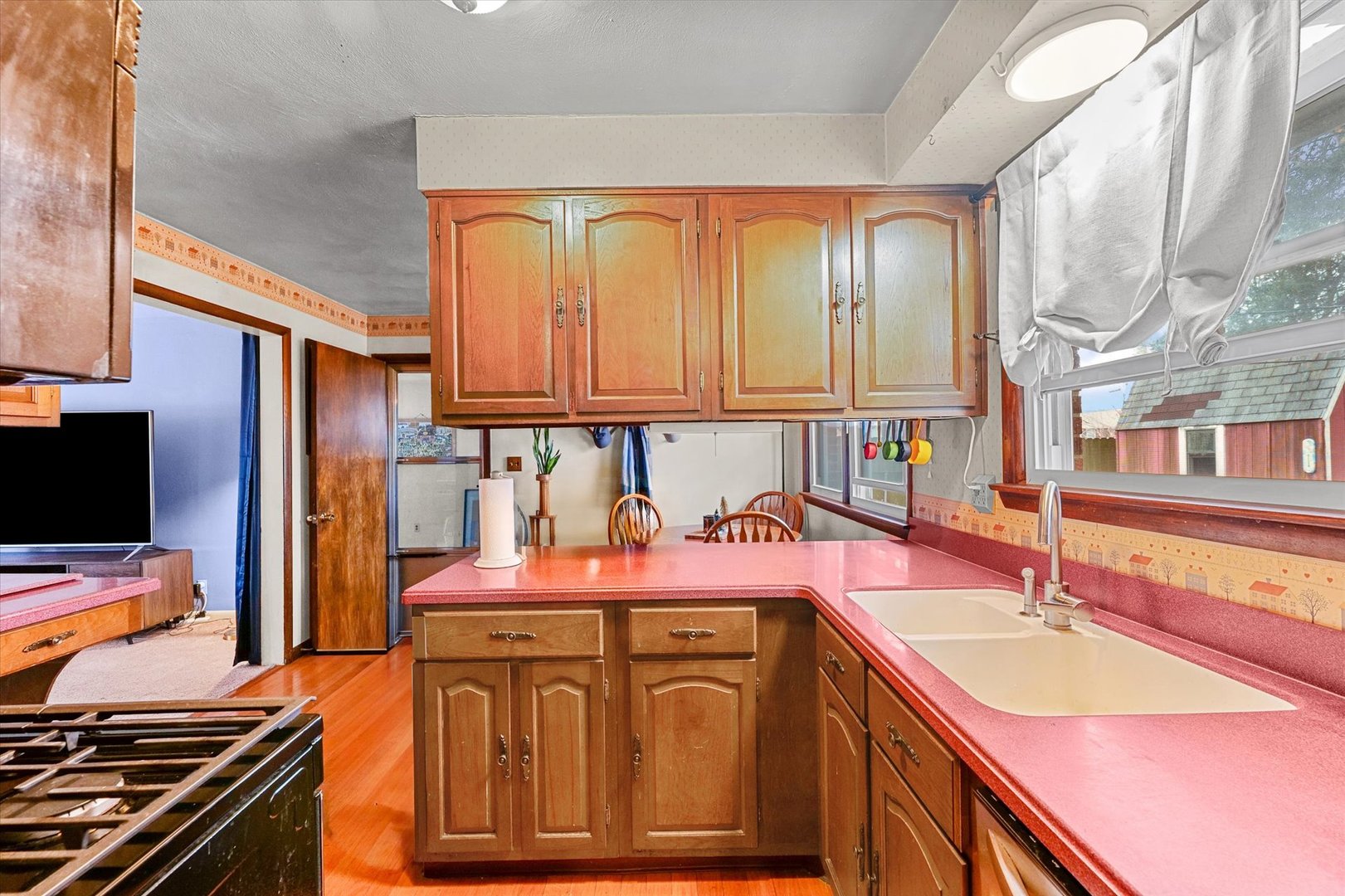 2213 Roland Drive Champaign, IL 61821 - Photo 8 of 21 a kitchen with stainless steel appliances granite countertop a sink stove and cabinets