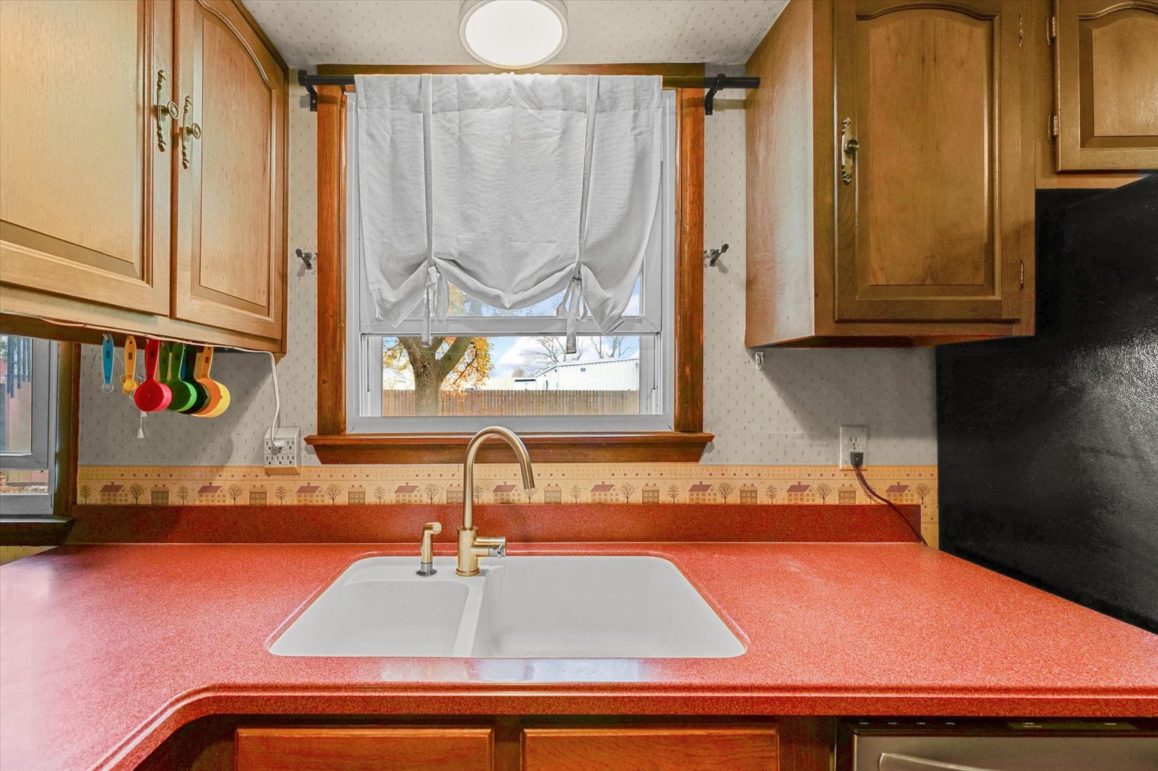 2213 Roland Drive Champaign, IL 61821 - Photo 9 of 21 a kitchen with a sink and a window