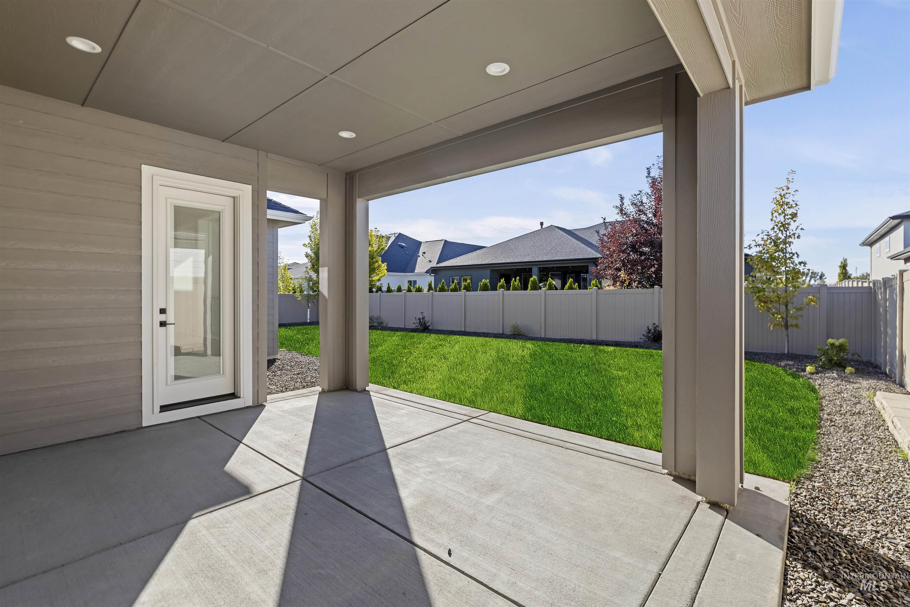 2247 East Blakehurst Street Kuna, ID 83634 - Photo 23 of 27 Fenced backyard with a rear covered patio area