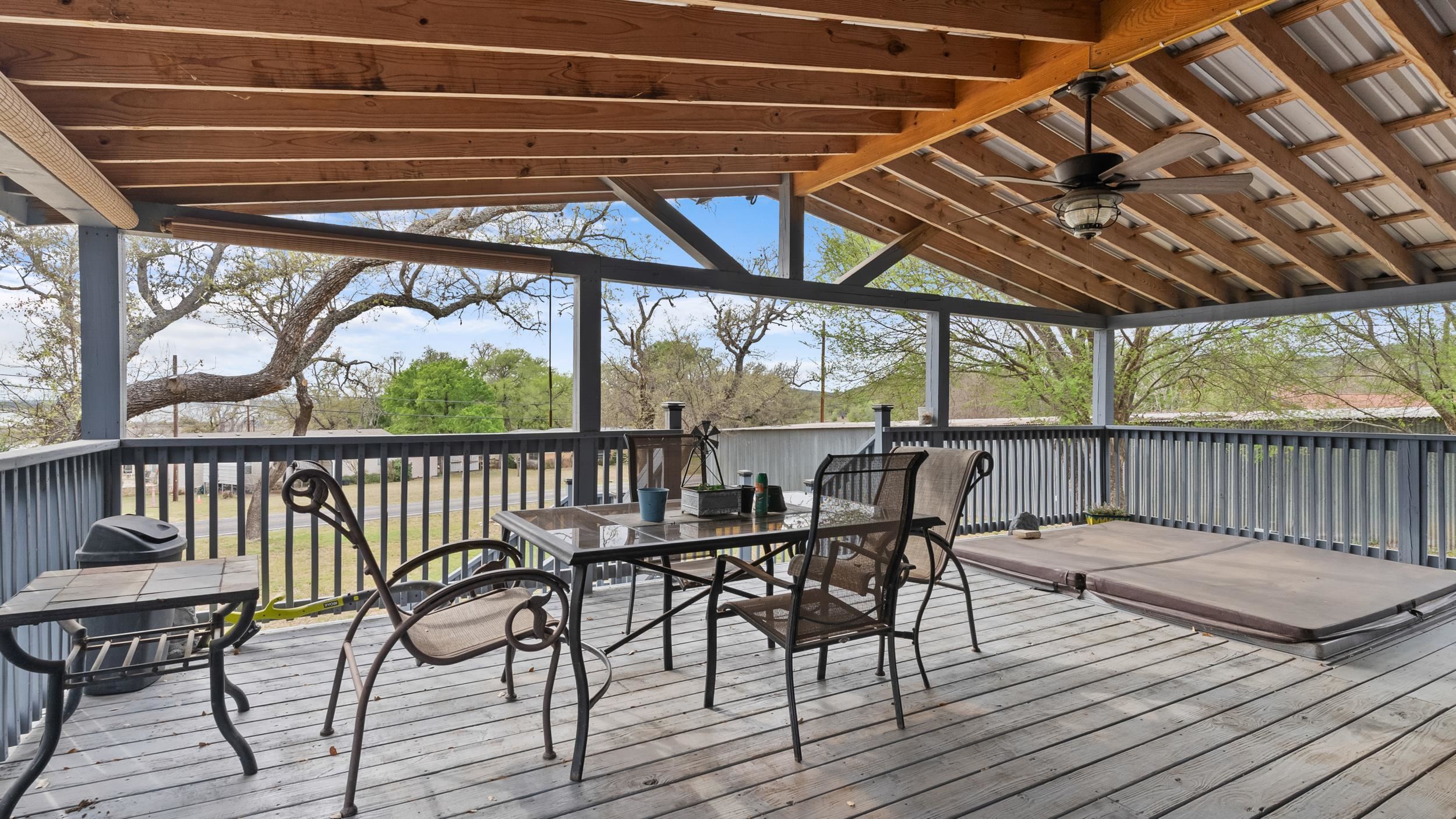 12409 Ranch Road 2341 Burnet, TX 78611 - Photo 10 of 16 a view of a chairs and table on the deck