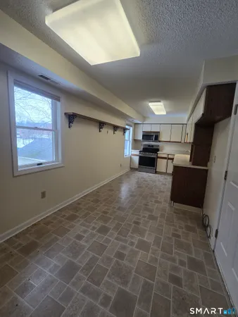 a view of livingroom with furniture and window