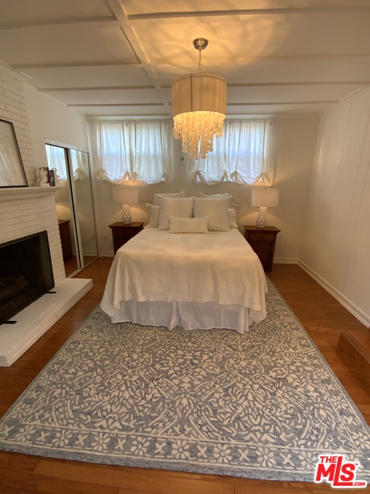 3969 Alla Road Los Angeles, CA 90066 - Photo 12 of 28 a bedroom with a bed and wooden floor
