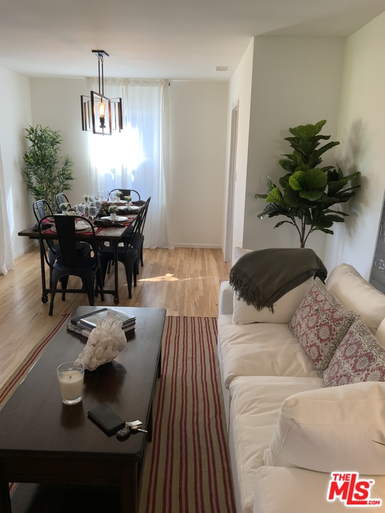 3969 Alla Road Los Angeles, CA 90066 - Photo 3 of 28 a living room with furniture and a chandelier