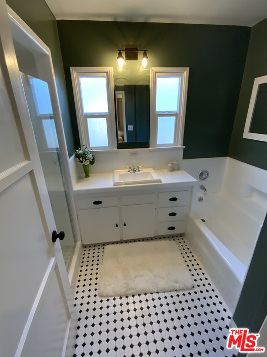 3969 Alla Road Los Angeles, CA 90066 - Photo 8 of 28 a bathroom with a bathtub sink vanity and mirror