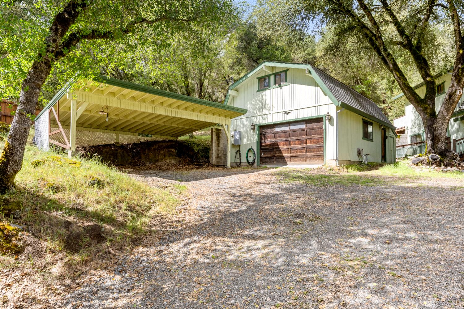 7321 Morning Canyon Road Placerville, CA 95667 - Photo 30 of 39 a front view of a house with a yard covered with snow