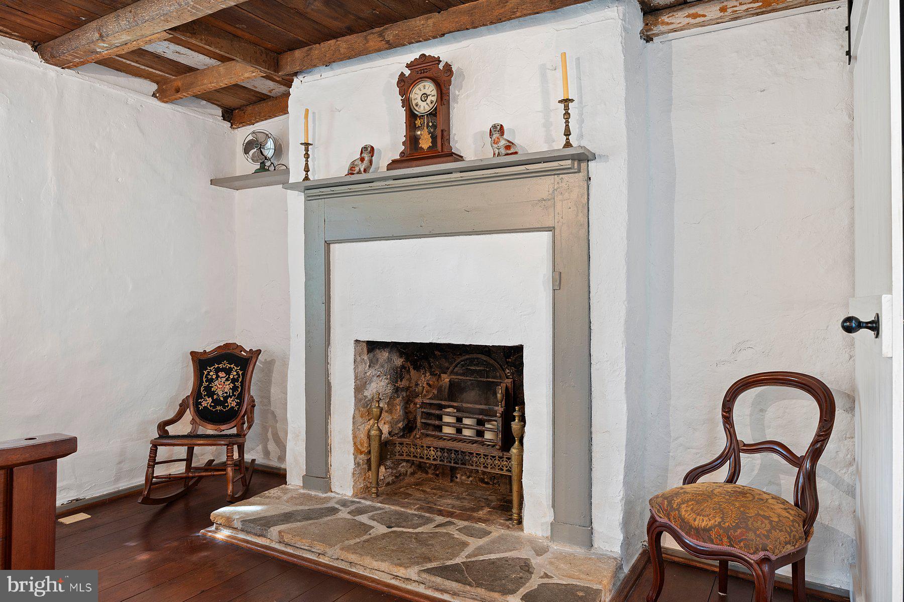 13704 Bardon Road Phoenix, MD 21131 - Photo 21 of 88 a living room with furniture and a fireplace