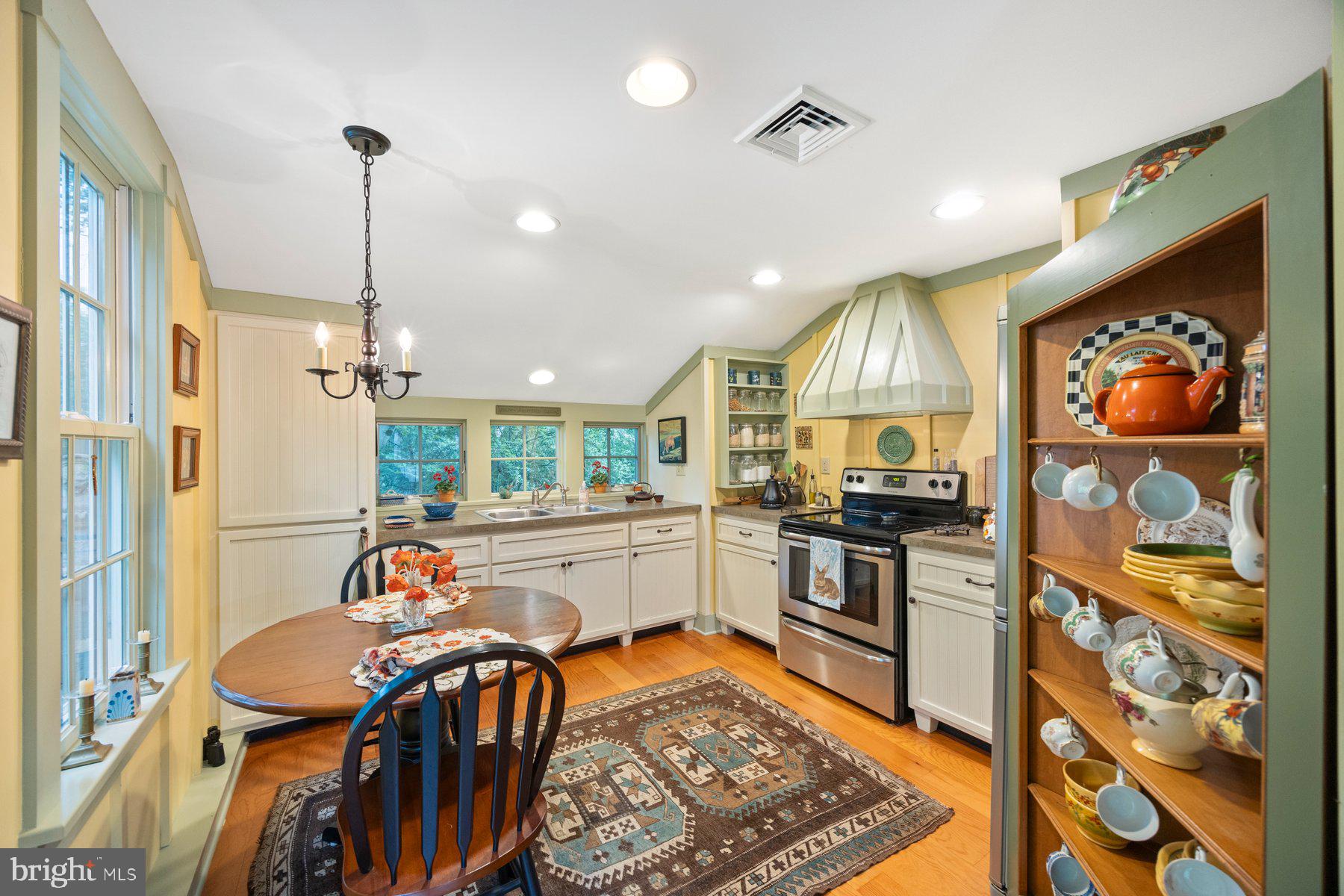 13704 Bardon Road Phoenix, MD 21131 - Photo 26 of 88 a kitchen with stainless steel appliances kitchen island granite countertop a refrigerator and a sink