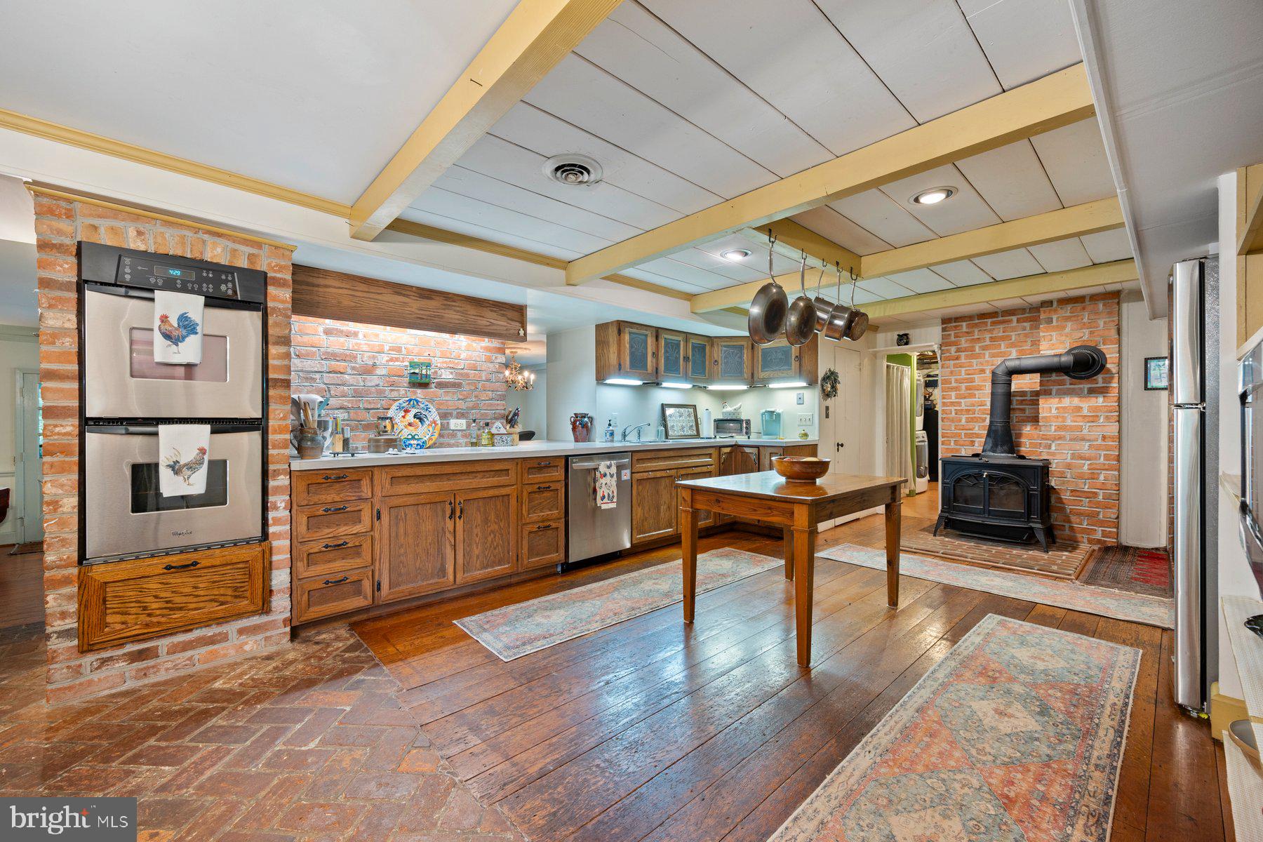 13704 Bardon Road Phoenix, MD 21131 - Photo 6 of 88 a living room with stainless steel appliances kitchen island granite countertop furniture and a large window