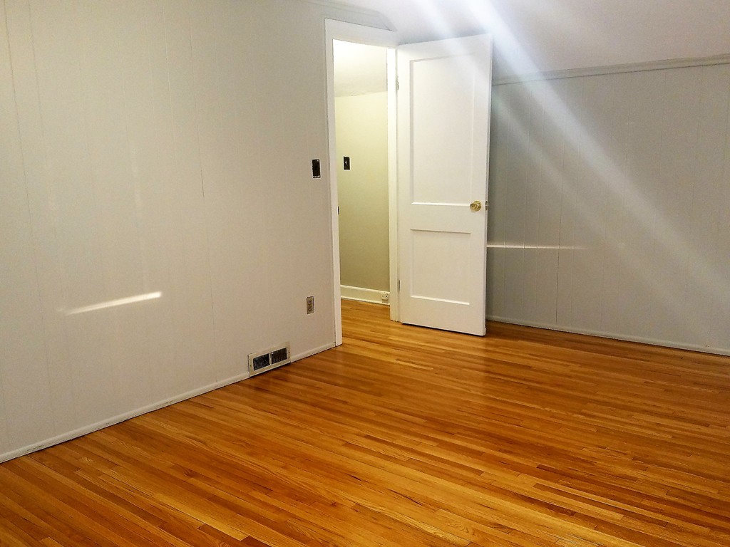 1763 Carew Street Springfield, MA 01104 - Photo 5 of 15 a view of an empty room with wooden floor