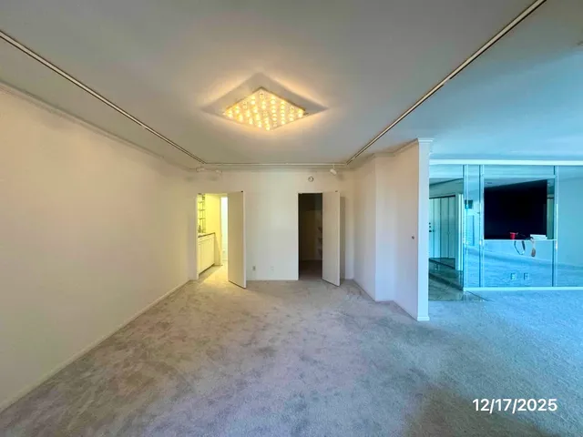 a view of empty room with windows