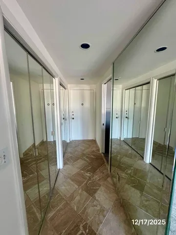 an empty room with a fireplace and window