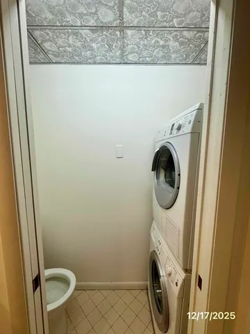 an empty room with a fireplace and fan