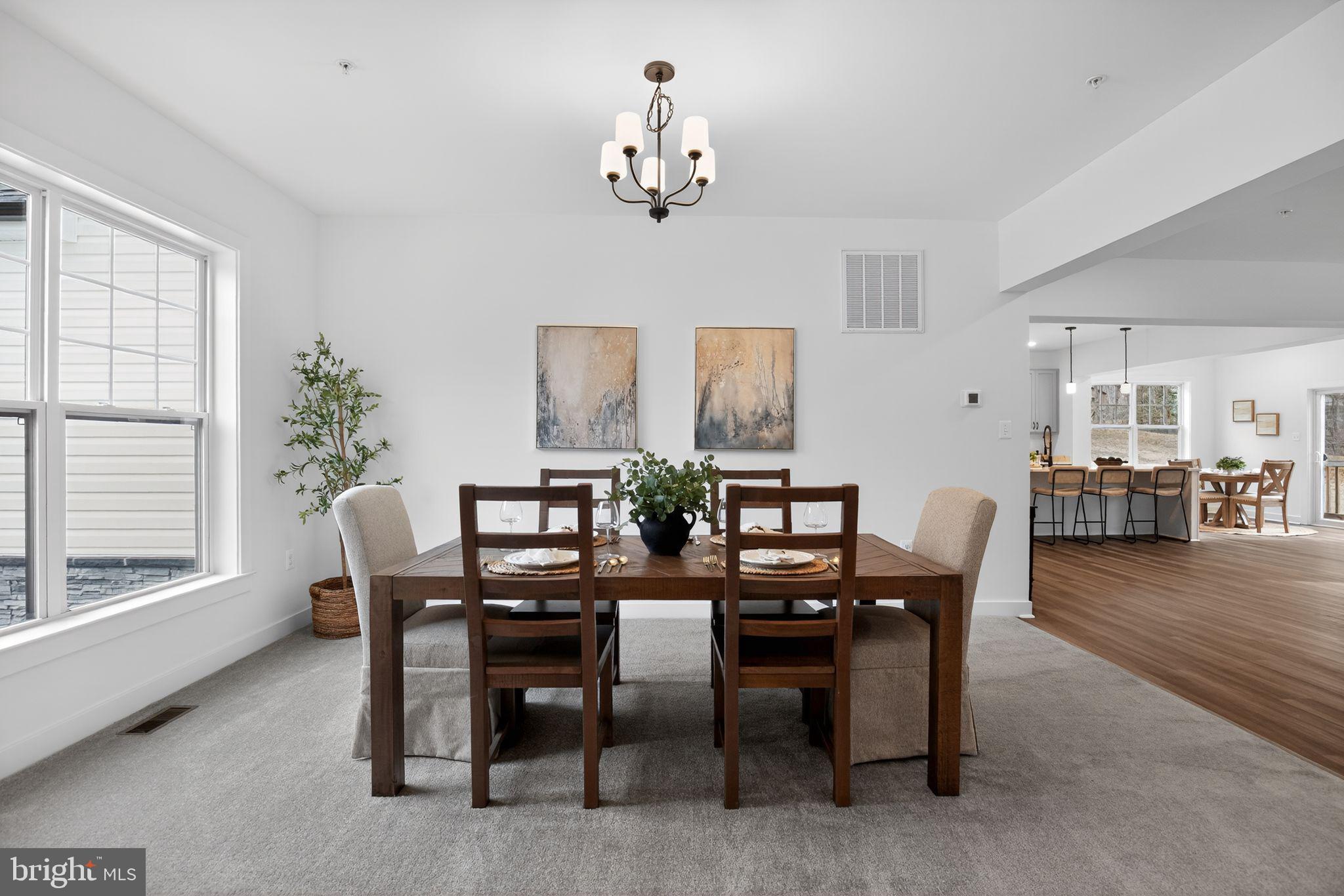 4747 Bryantown Road Waldorf, MD 20601 - Photo 12 of 62 a view of a dining room with furniture and chandelier