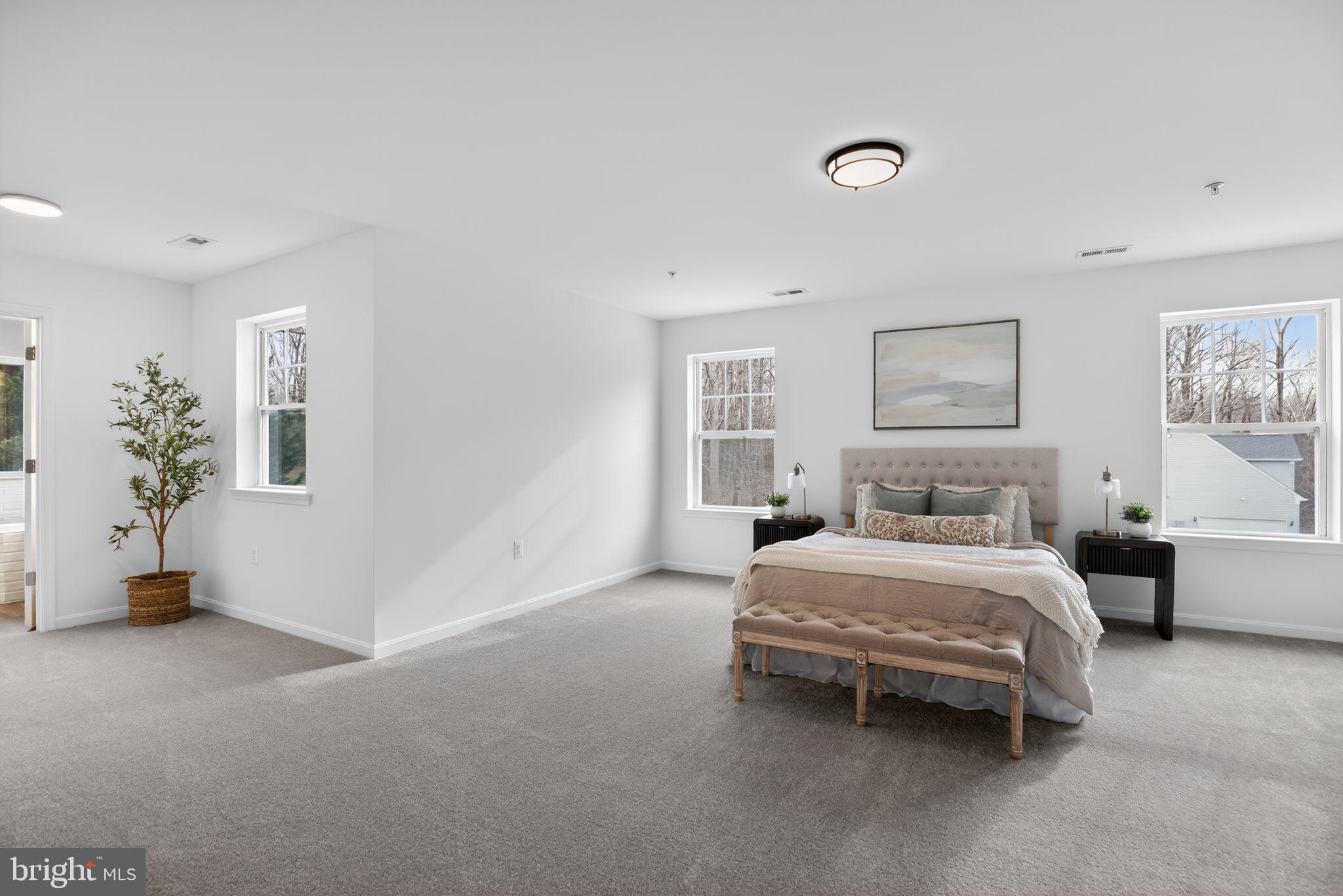 4747 Bryantown Road Waldorf, MD 20601 - Photo 17 of 62 a bedroom with a bed and lamp