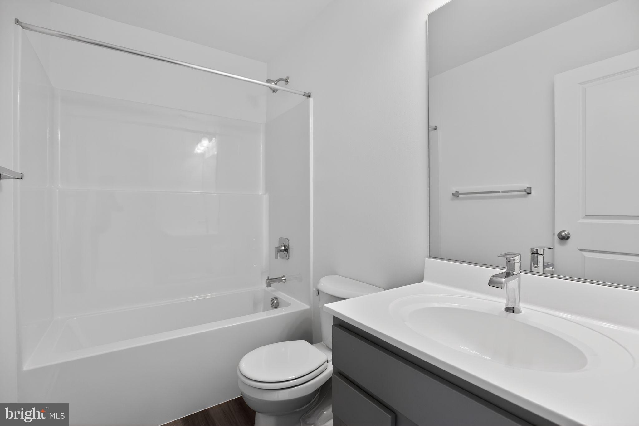 4747 Bryantown Road Waldorf, MD 20601 - Photo 20 of 62 a bathroom with a sink toilet and shower