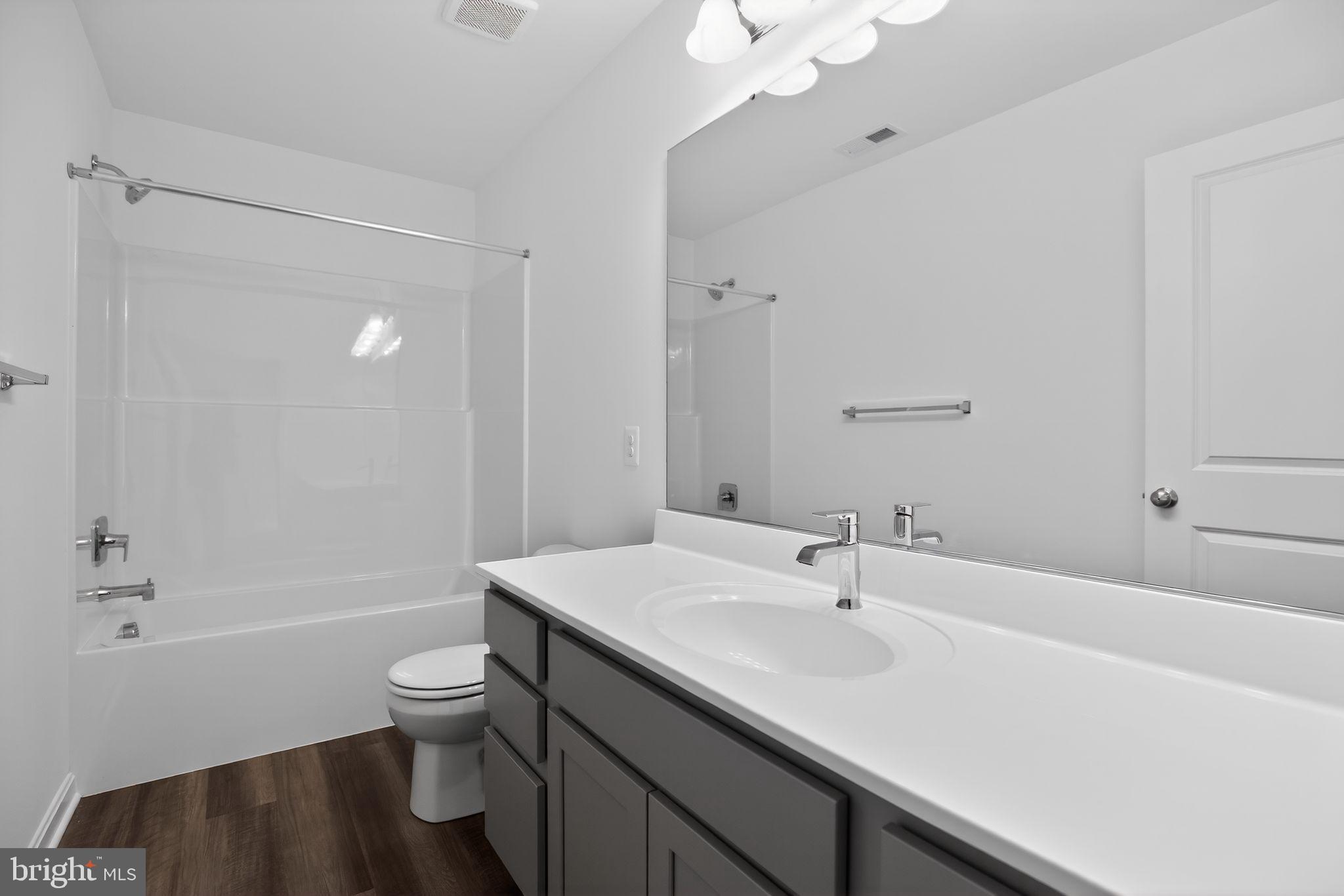 4747 Bryantown Road Waldorf, MD 20601 - Photo 21 of 62 a bathroom with a sink a toilet and shower