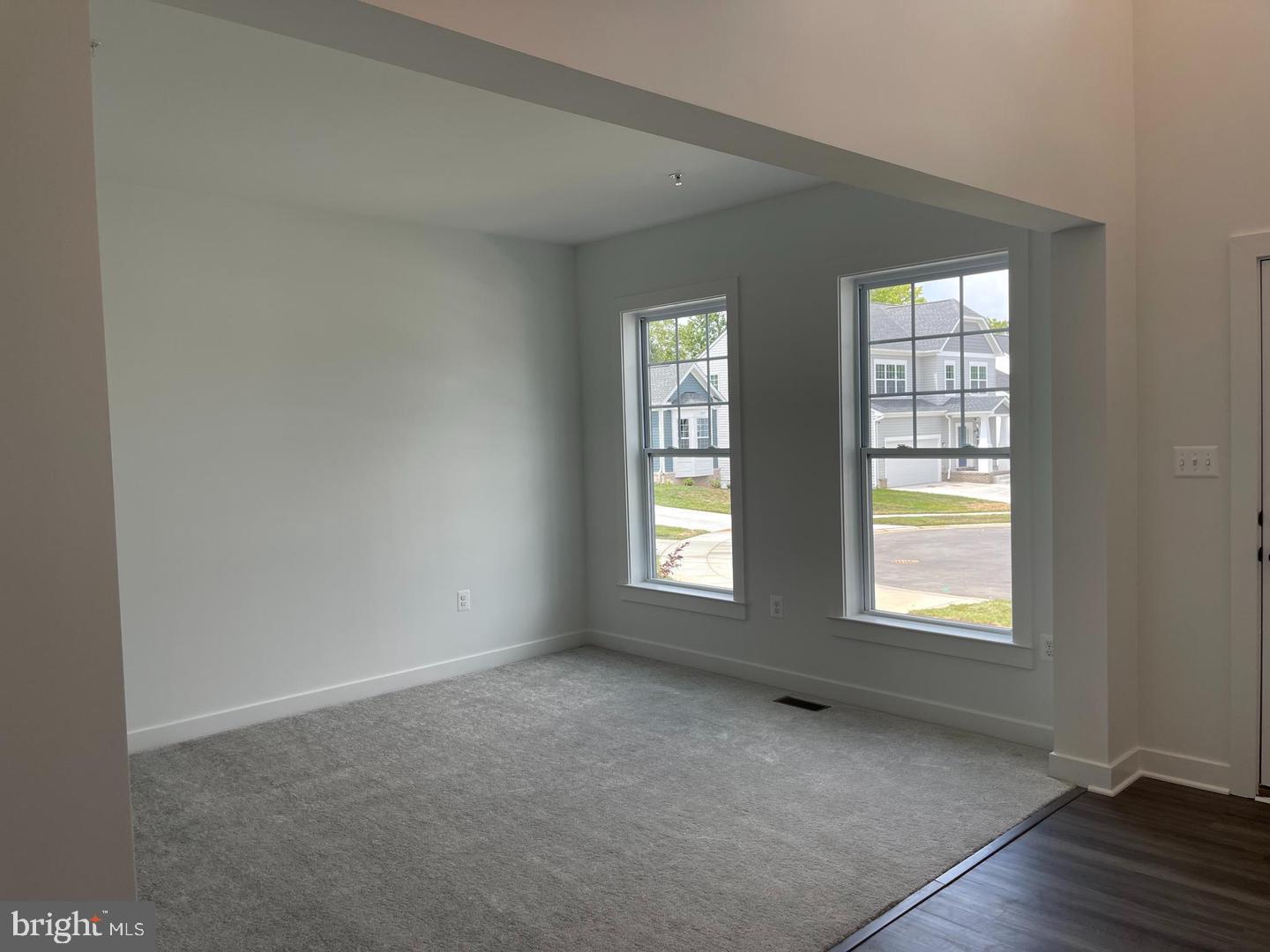 4747 Bryantown Road Waldorf, MD 20601 - Photo 56 of 62 an empty room with wooden floor and windows