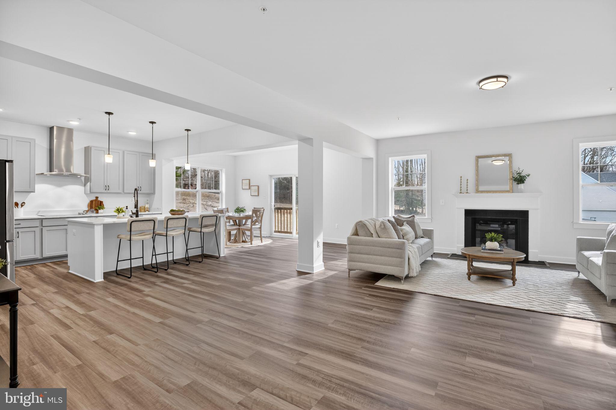 4747 Bryantown Road Waldorf, MD 20601 - Photo 7 of 62 a living room with furniture and a fireplace