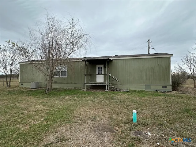 a house view with a backyard space
