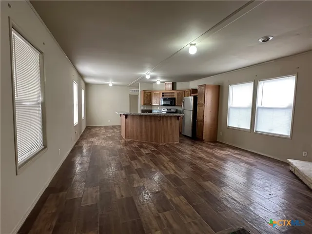 a view of a electric appliances in kitchen and empty room