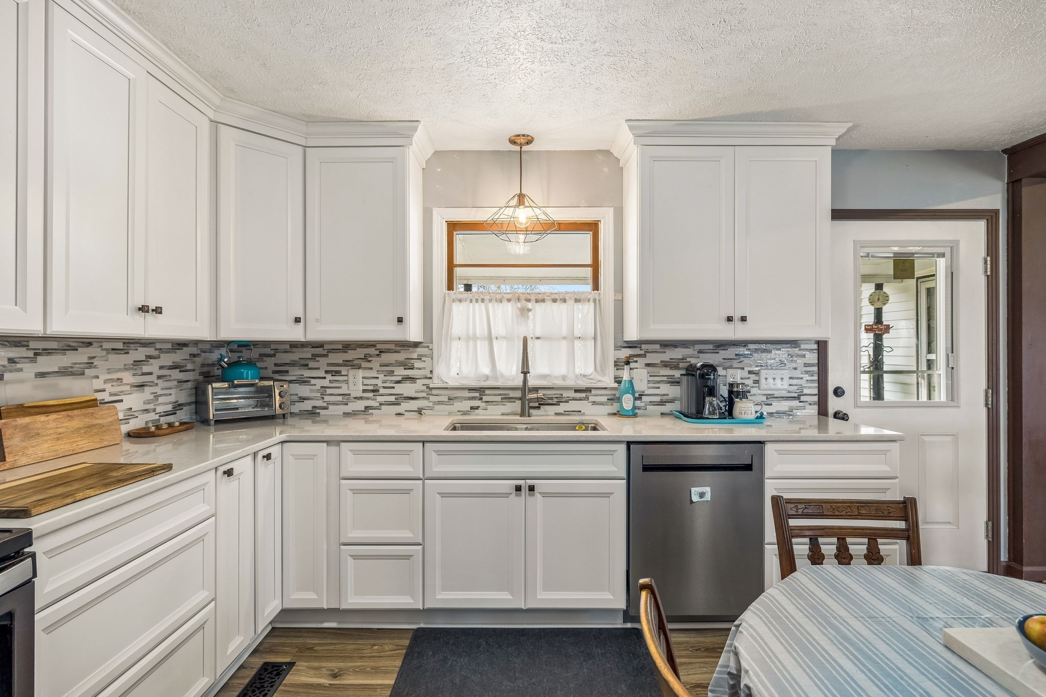6200 Pinewood Road Nunnelly, TN 37137 - Photo 50 of 57 a kitchen with white cabinets and sink