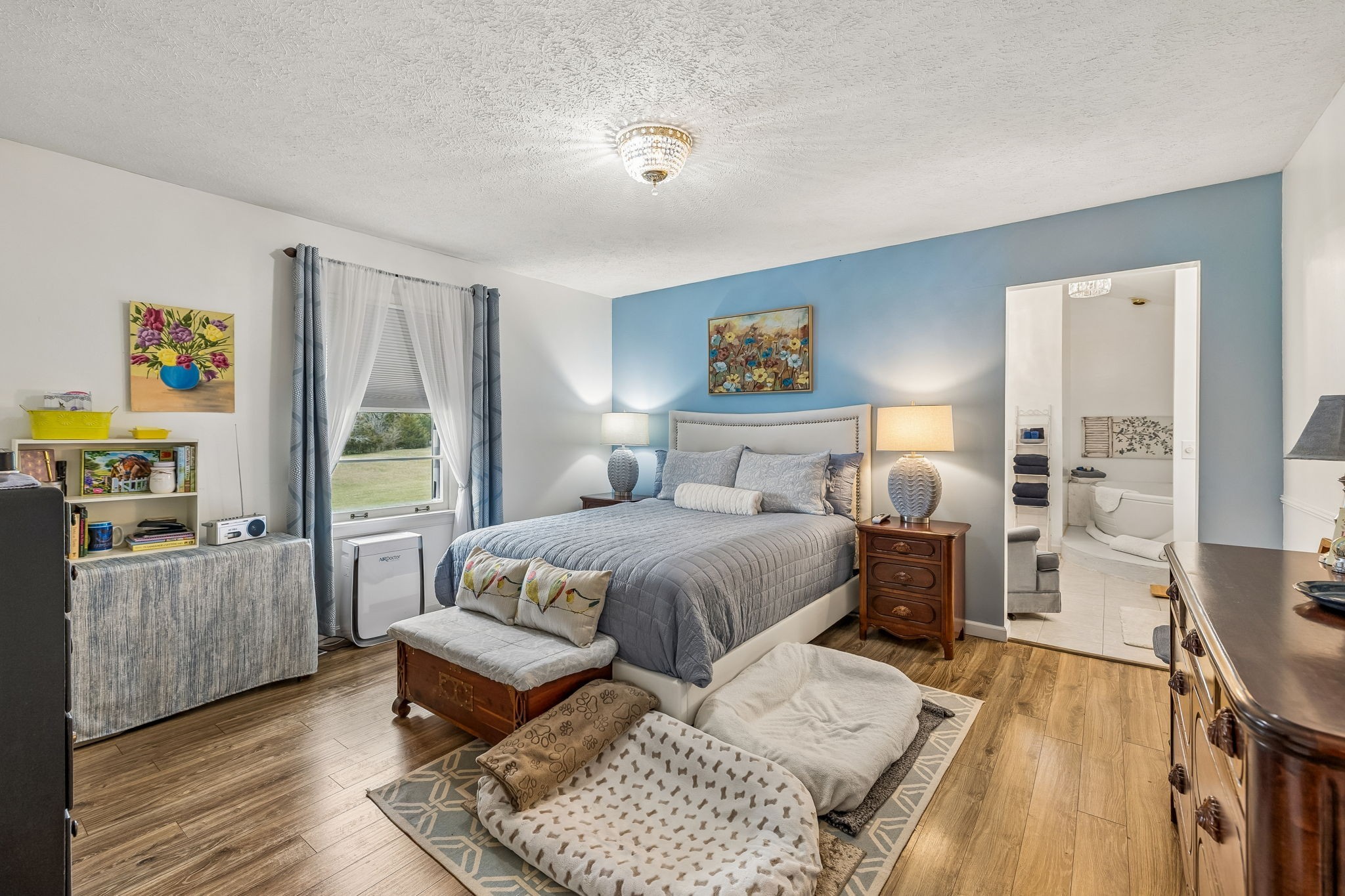 6200 Pinewood Road Nunnelly, TN 37137 - Photo 53 of 57 a bedroom with a bed and wooden floor