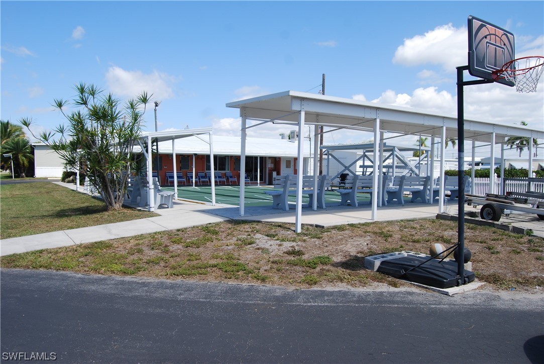 20690 Port Drive Estero, FL 33928 - Photo 5 of 5 a view of a house with a backyard and porch