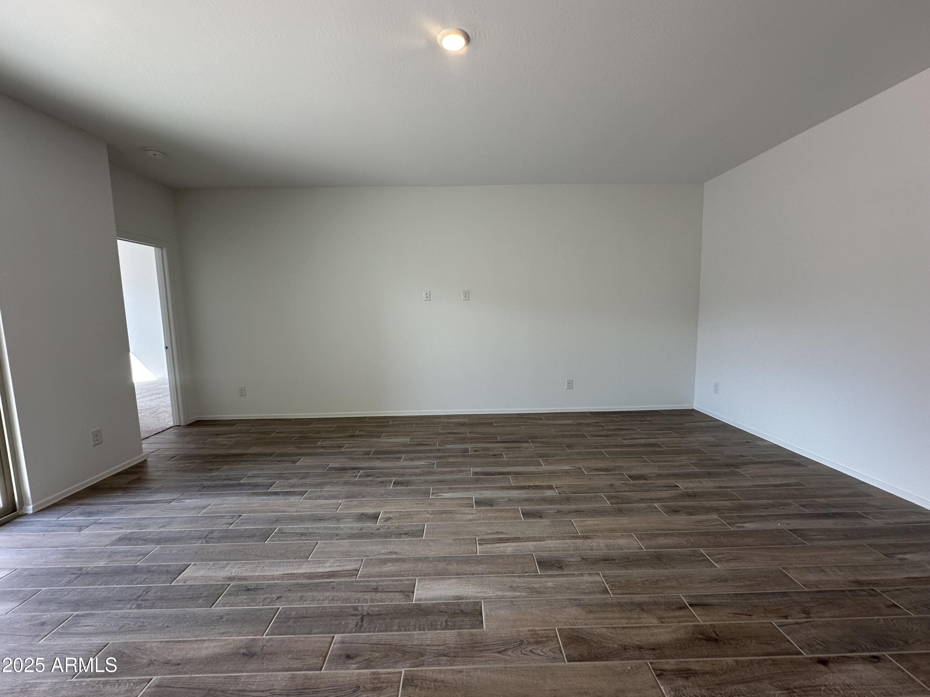 47691 West Moeller Road Maricopa, AZ 85139 - Photo 11 of 31 a view of wooden floor and hall in a room