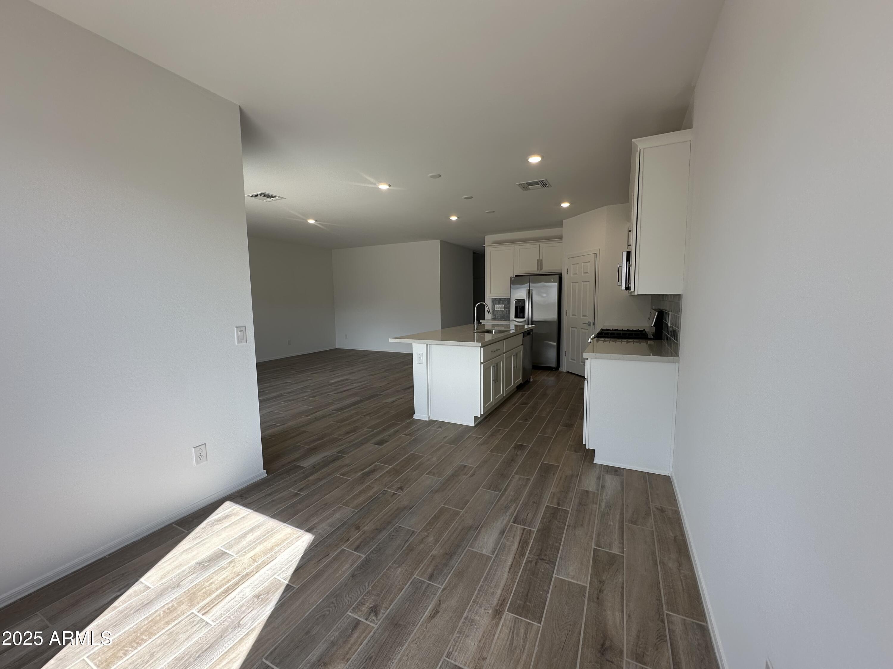 47691 West Moeller Road Maricopa, AZ 85139 - Photo 15 of 31 a view of kitchen with wooden floor and electronic appliances