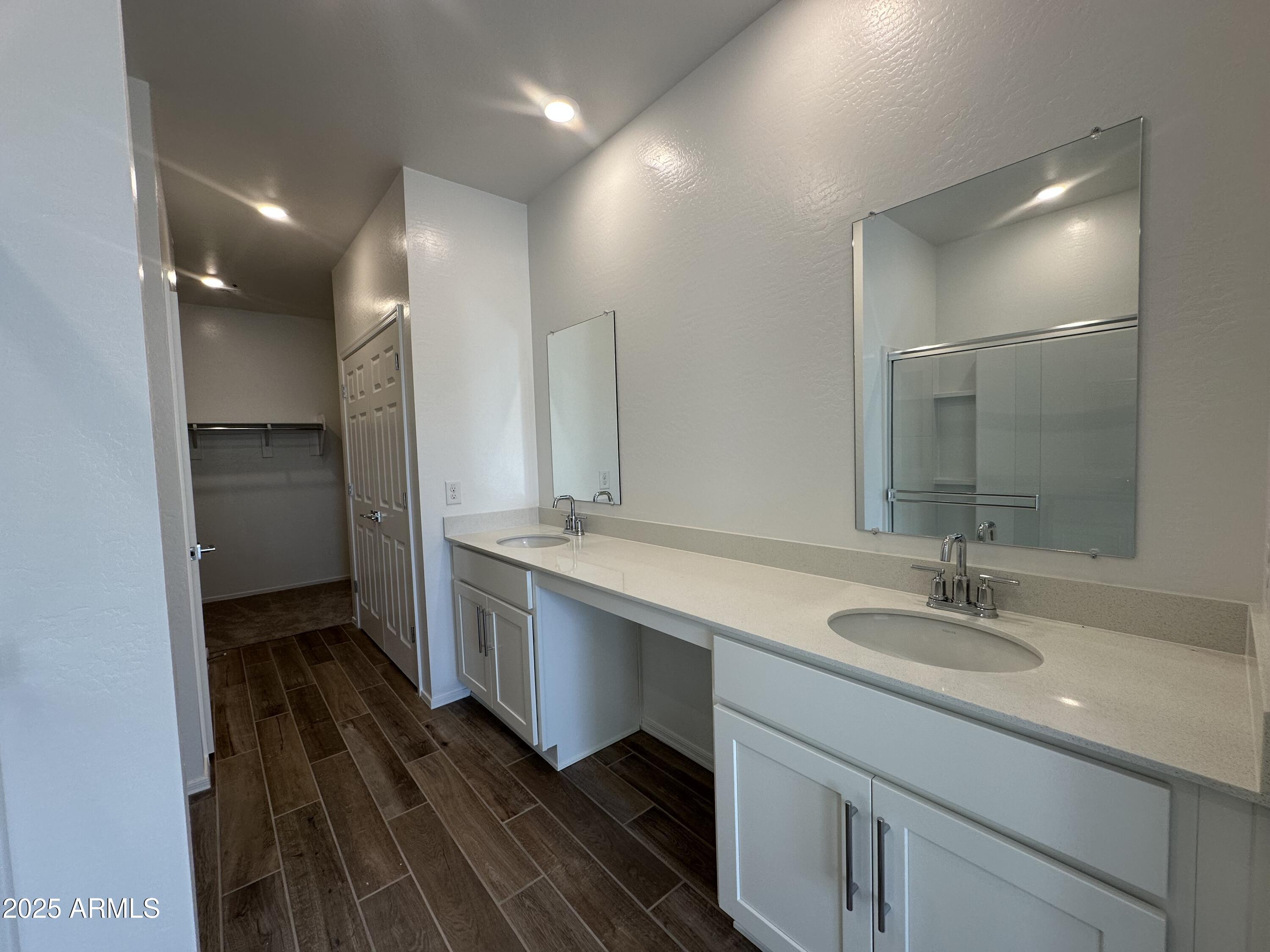 47691 West Moeller Road Maricopa, AZ 85139 - Photo 19 of 31 a bathroom with a double vanity sink a and a mirror