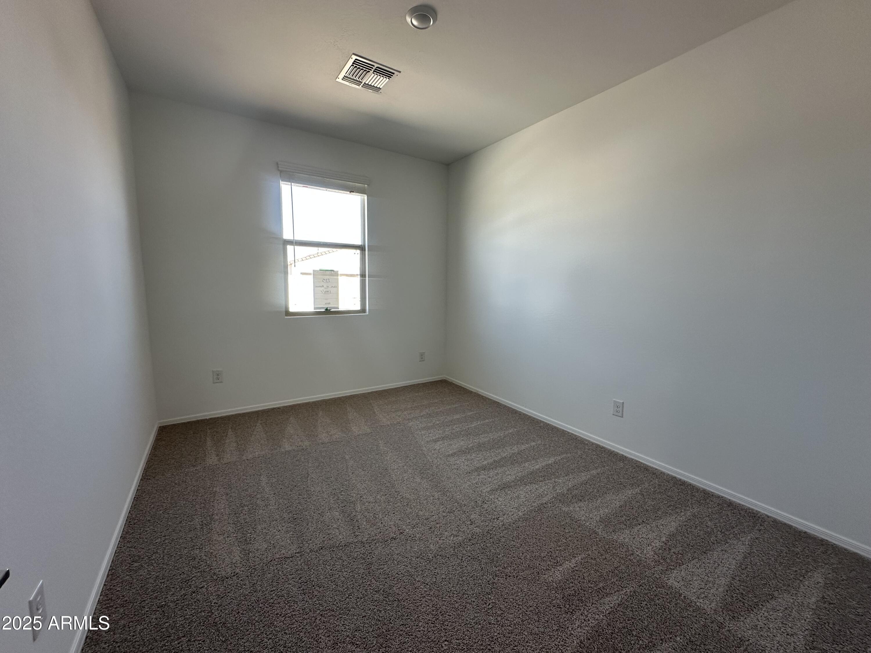 47691 West Moeller Road Maricopa, AZ 85139 - Photo 4 of 31 an empty room with a window