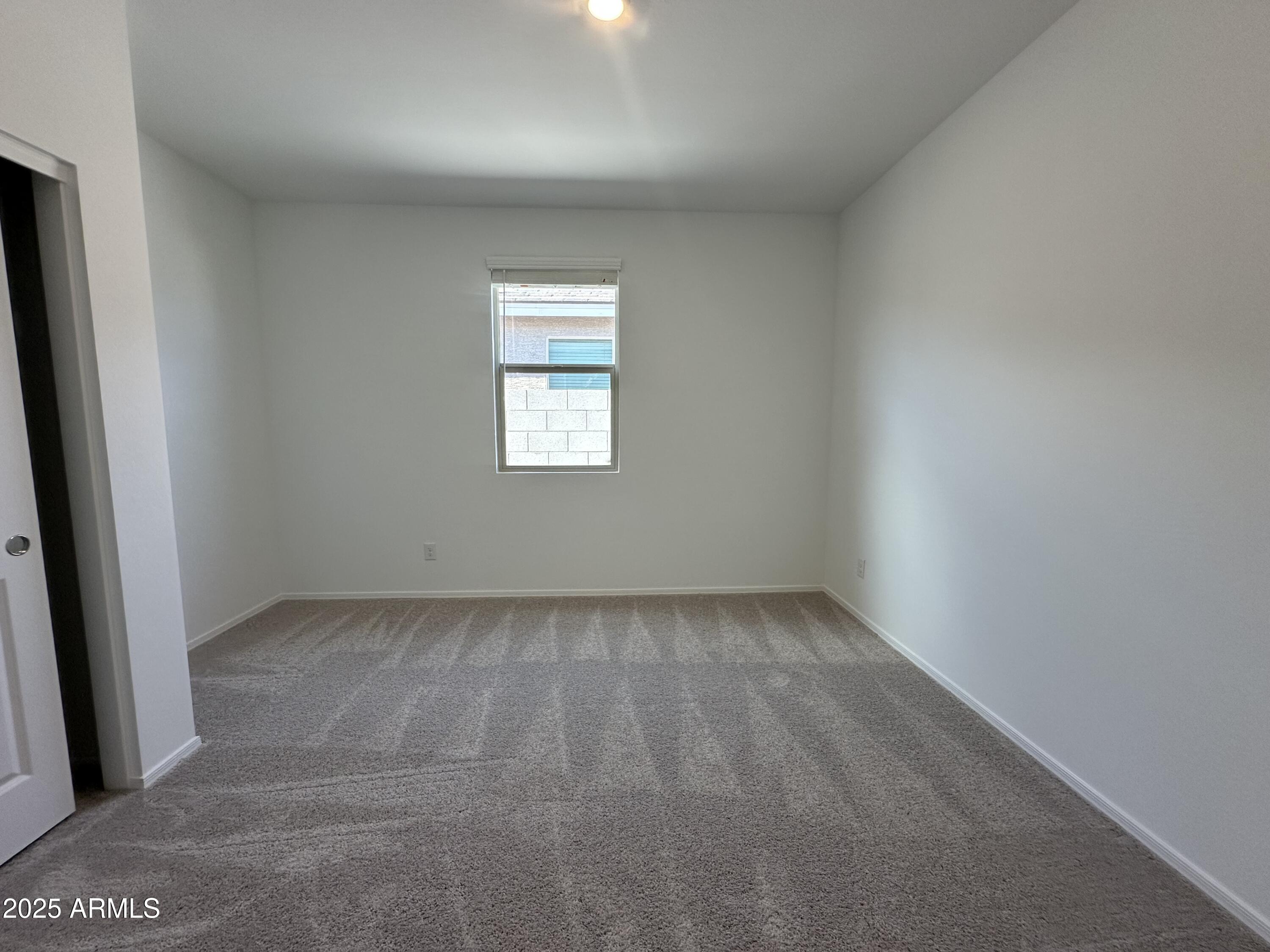 47691 West Moeller Road Maricopa, AZ 85139 - Photo 7 of 31 an empty room with a window