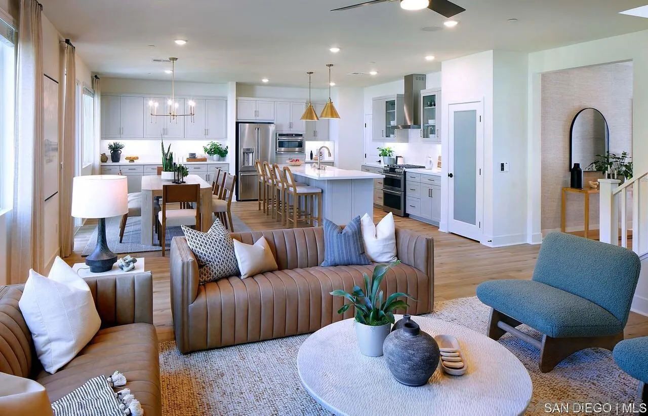 709 Meadowood Street, Unit 328 Fallbrook, CA 92028 - Photo 3 of 11 a living room with furniture kitchen and a potted plant