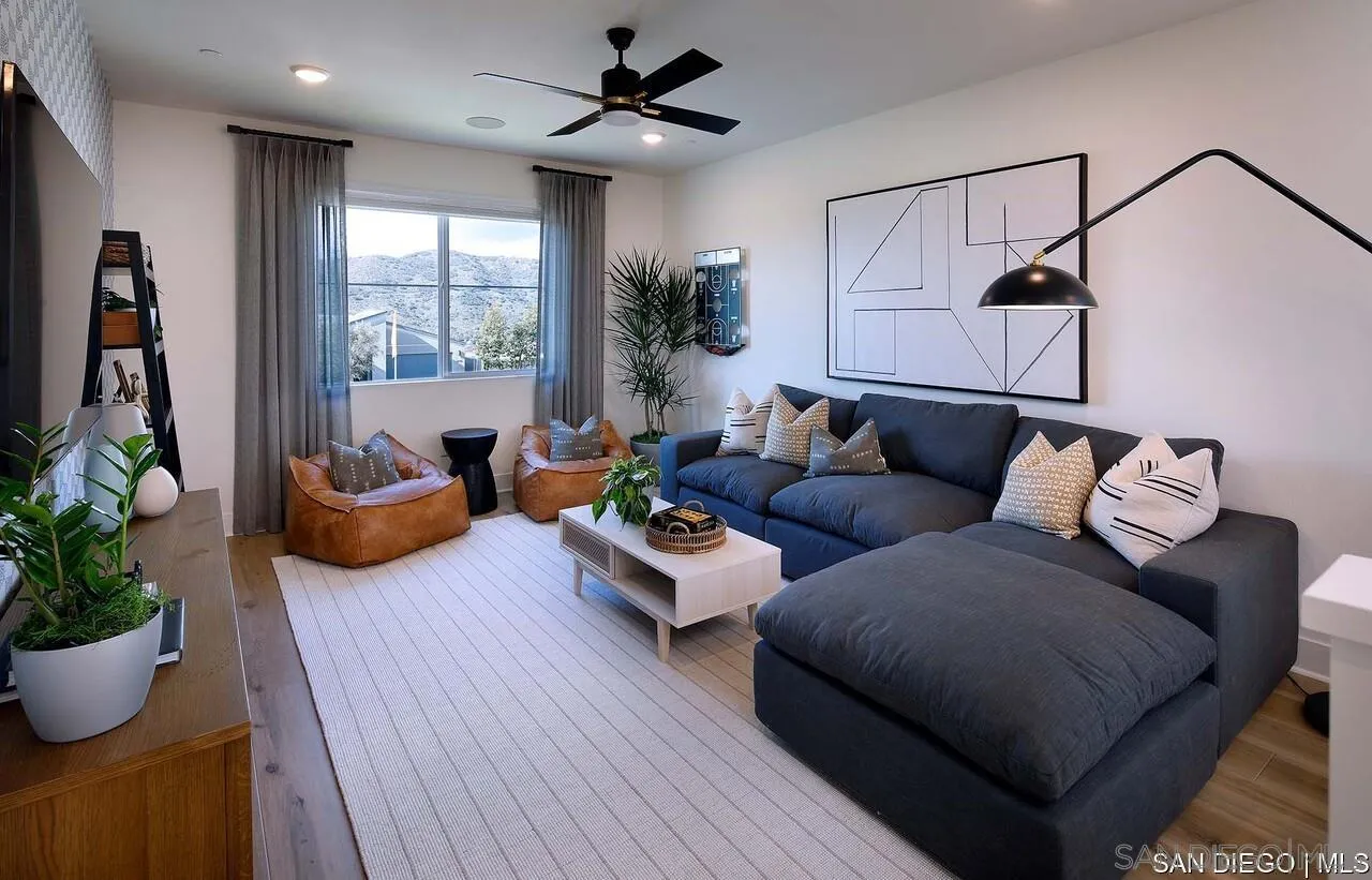 709 Meadowood Street, Unit 328 Fallbrook, CA 92028 - Photo 4 of 11 a living room with furniture and a potted plant