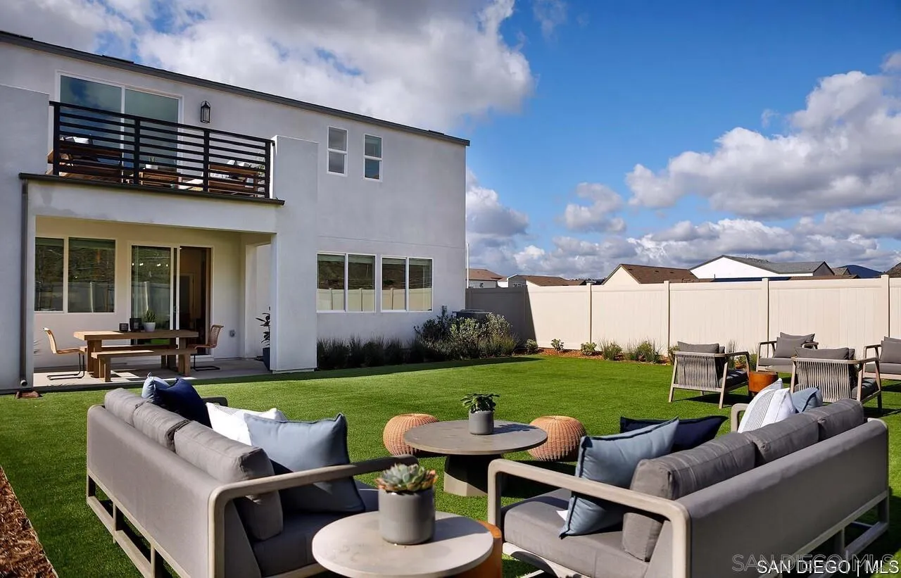 709 Meadowood Street, Unit 328 Fallbrook, CA 92028 - Photo 10 of 11 a view of a patio with couches chairs and a yard