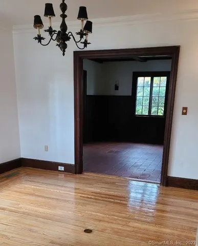 a view of room with hardwood floor and window