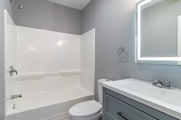 a bathroom with a sink a toilet and a bathtub
