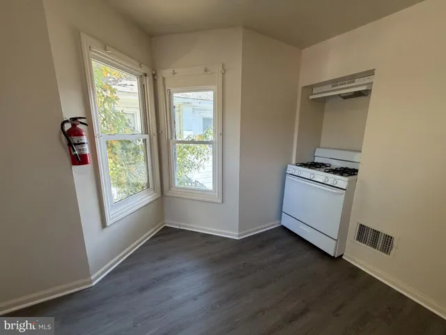 a view of kitchen and wooden floor