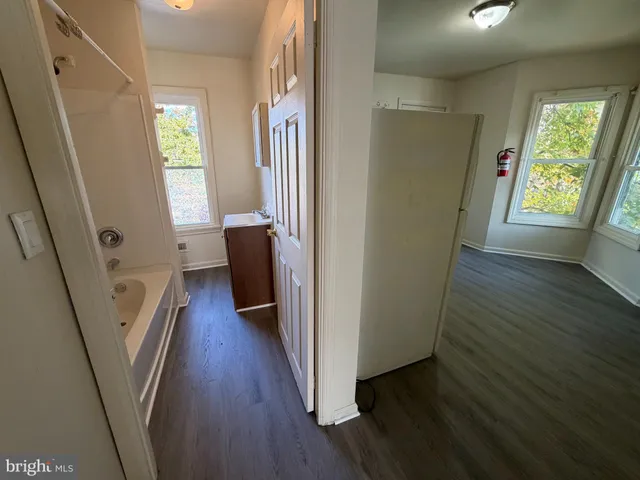 a view of an entryway with wooden floor