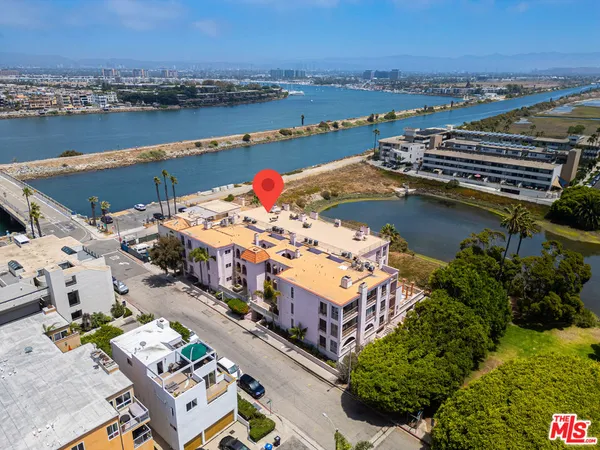 an aerial view of a house with a ocean view